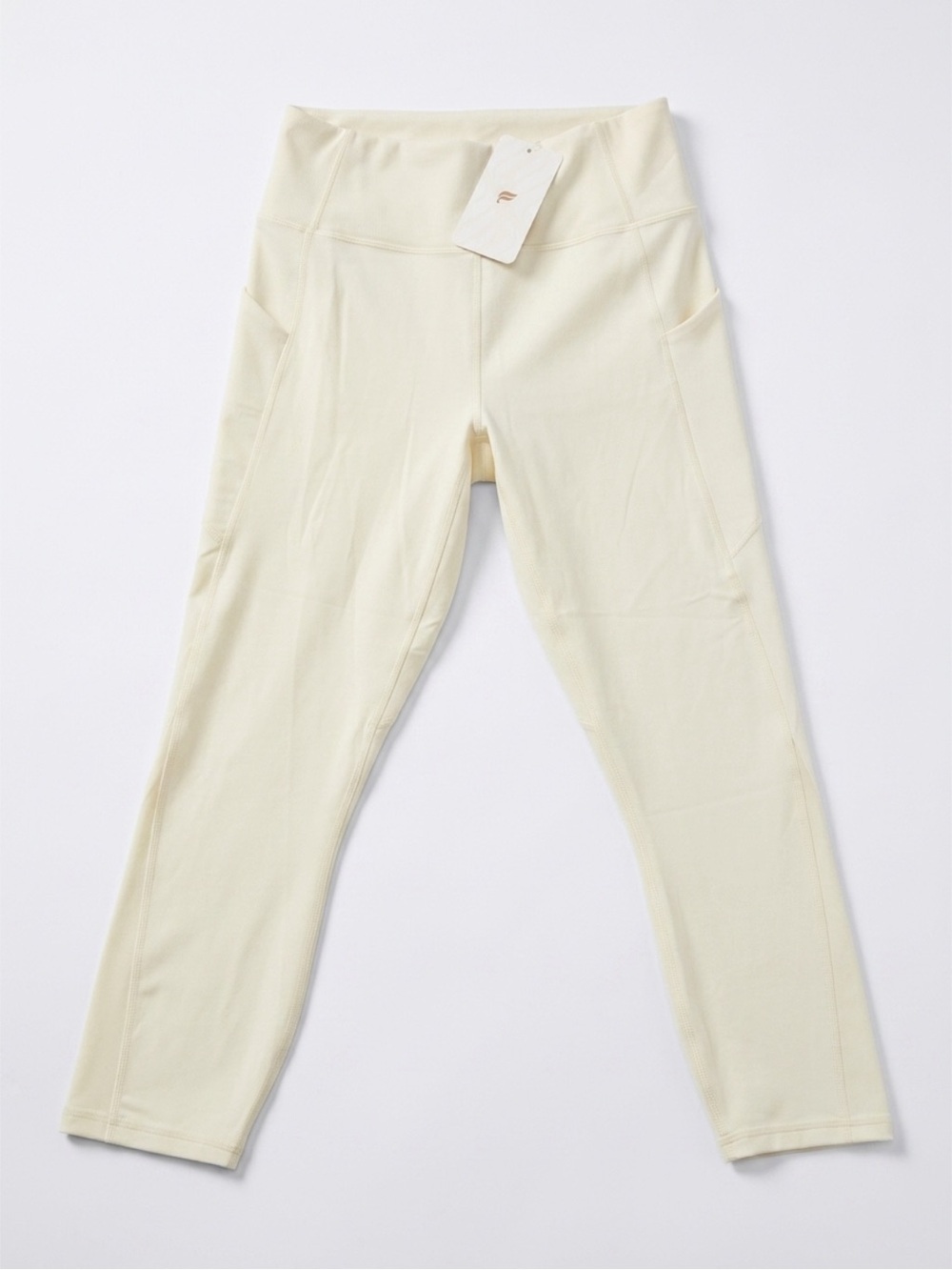 Fabletics Oasis High-Waisted Pocket Capri in Cream